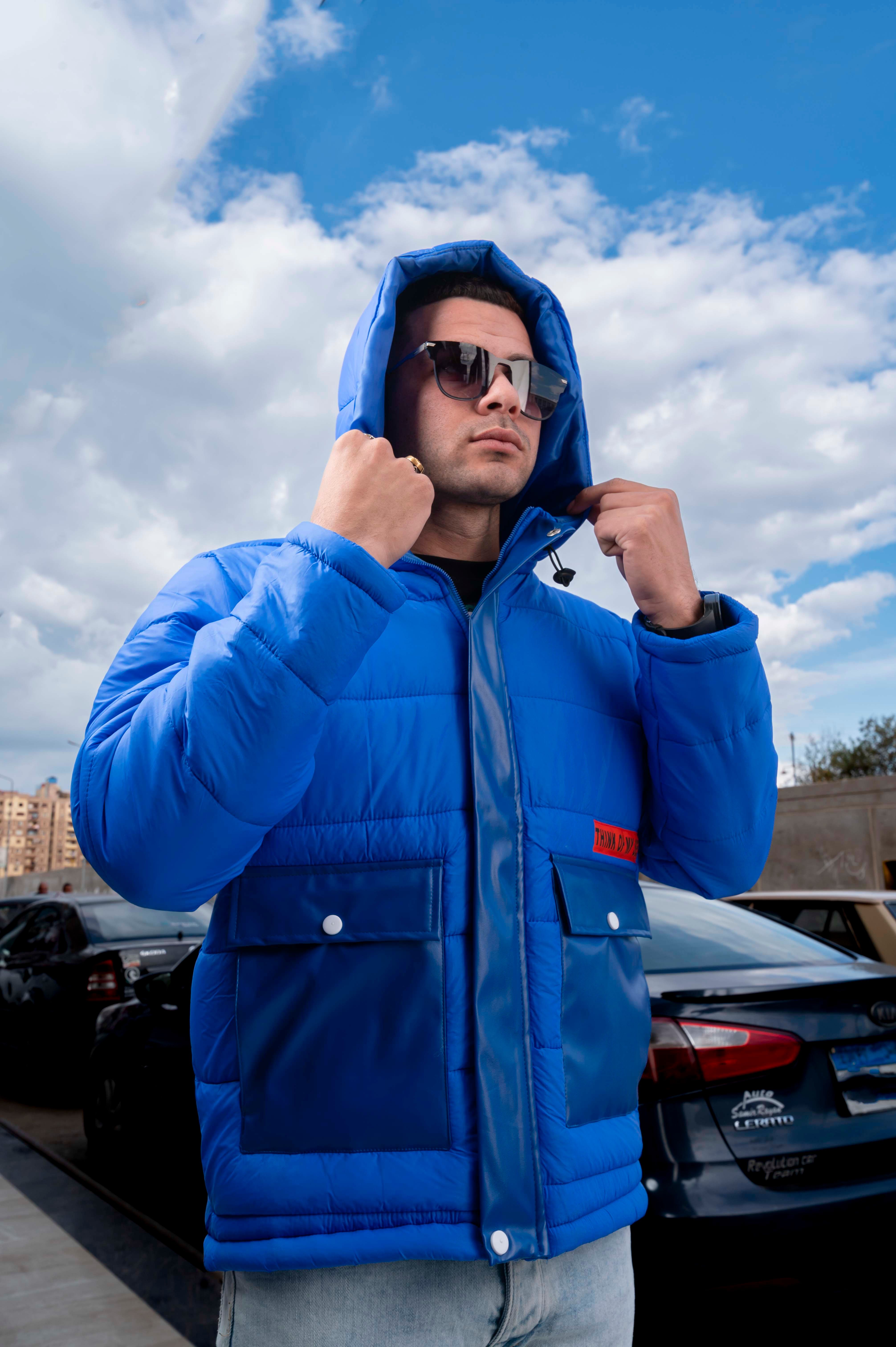 Man in white puffer jacket and black sunglasses free stock photo