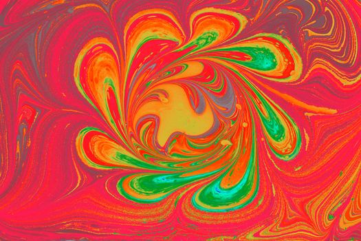 Colorful abstract swirl artwork with vivid red, orange, and green tones creating a dynamic pattern.