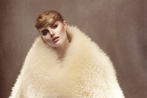 A Woman in Beige Fur Coat