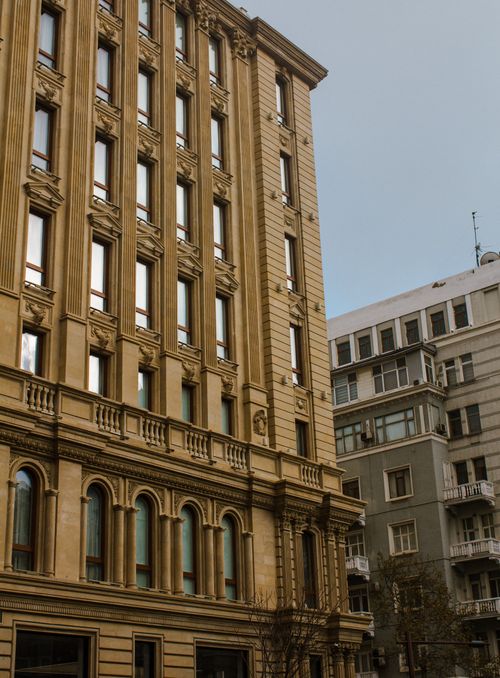 Free A vertical shot of historic and modern buildings showcasing urban architecture. Stock Photo