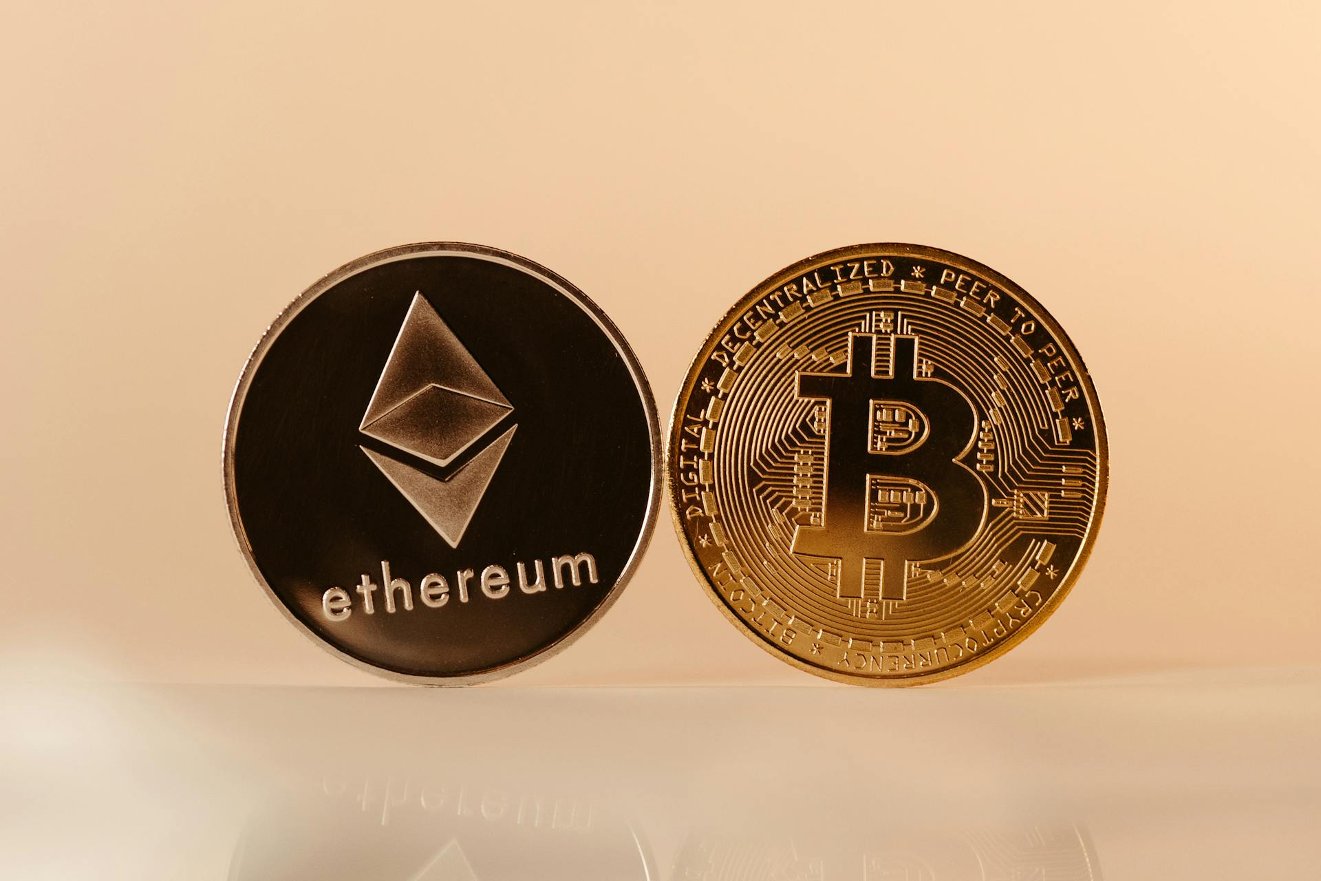 Close-up of Ethereum and Bitcoin coins representing modern digital currency and blockchain technology.