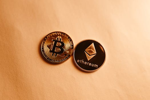 Bitcoin and Ethereum coins depicted on a soft yellow background for cryptocurrency and finance themes.