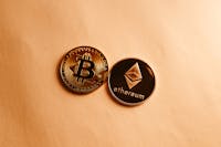 Bitcoin and Ethereum Slide Amidst ETF Outflows and Global Tensions