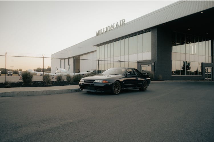 Black Sports Car Parked In Front Of The Million Air Headquarters