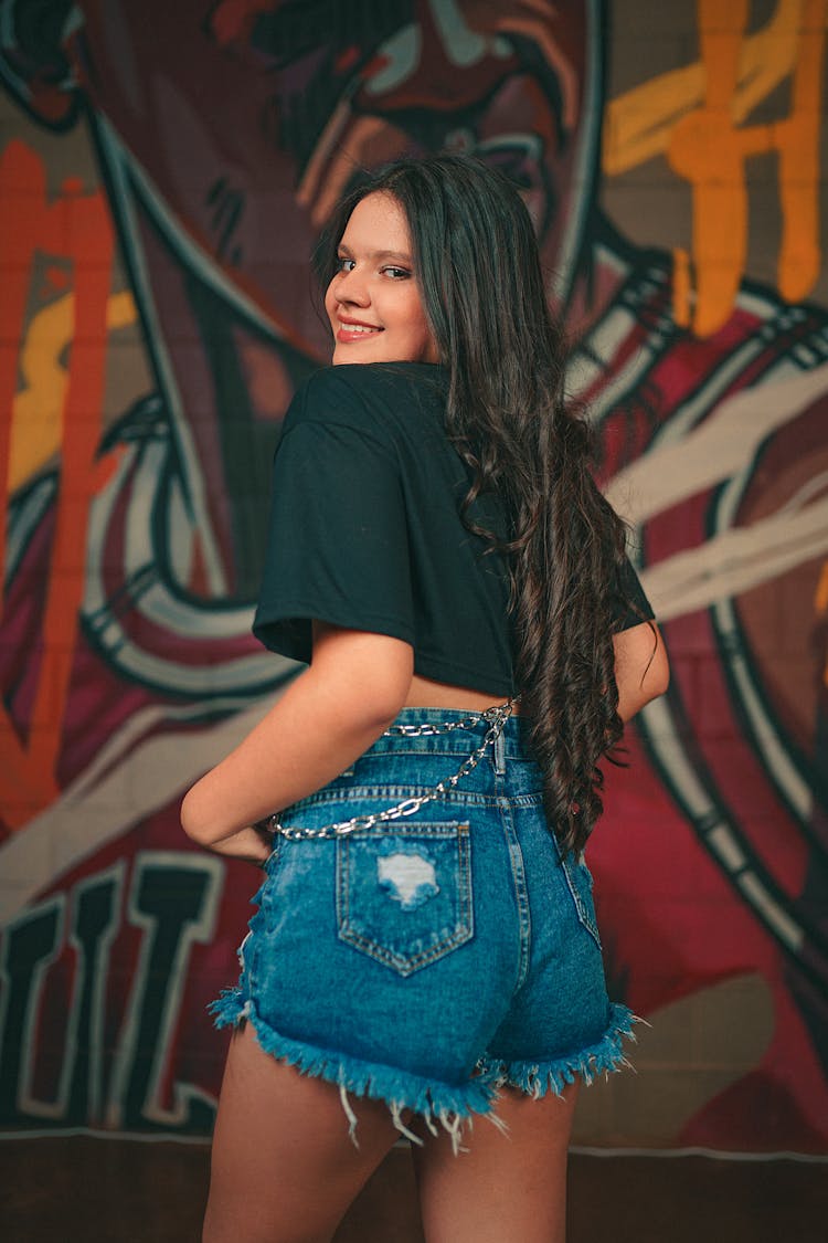 Woman In A Crop Top Looking Over Her Shoulder 