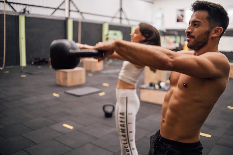 A Man And A Woman Working Out 