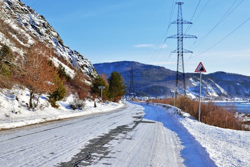 Road in a Mountain Landscape in Snow