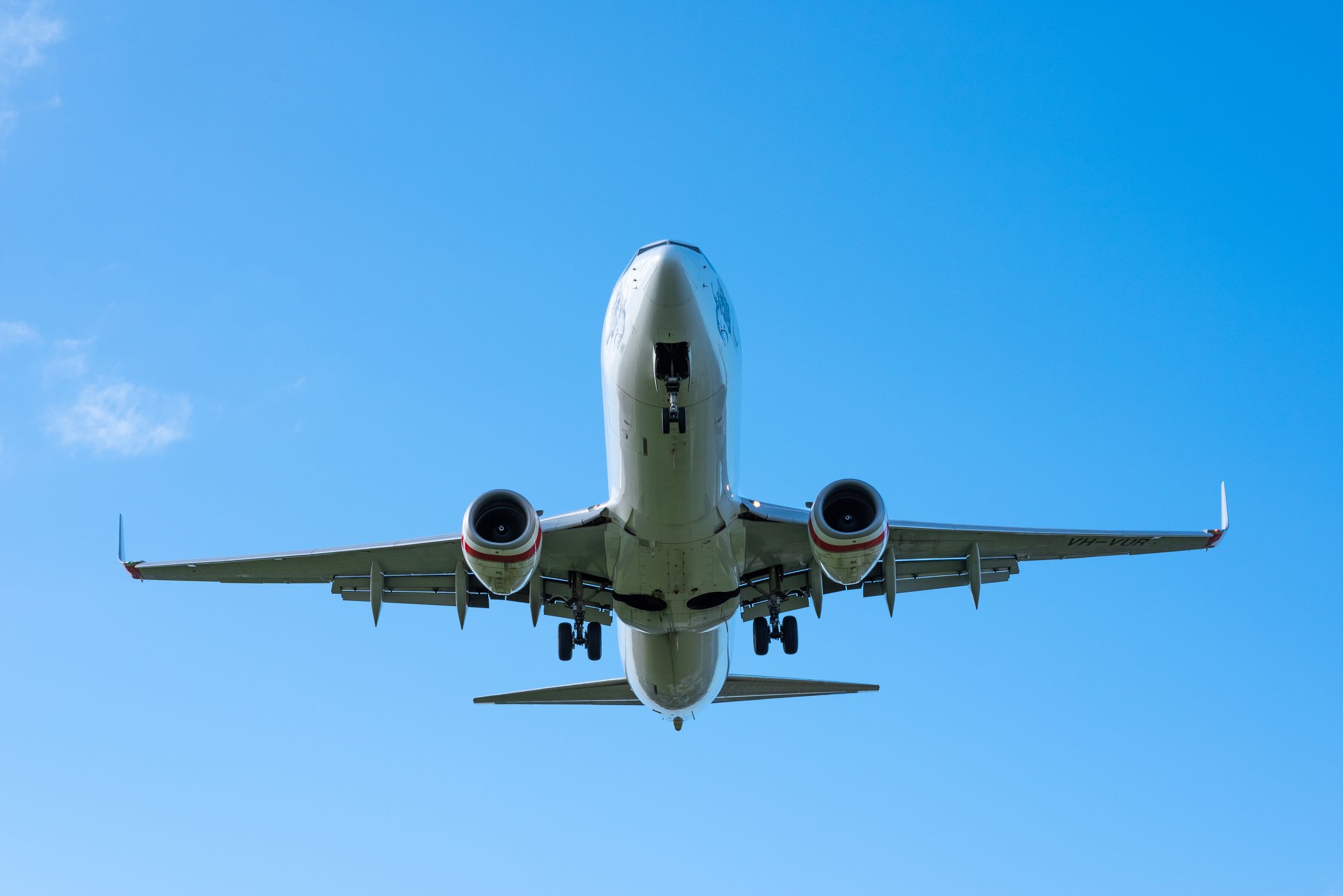 An Airplane Across the Blue Sky · Free Stock Photo