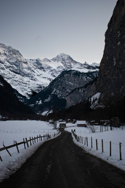 An Unpaved Road in a Mountain Valley in Winter 