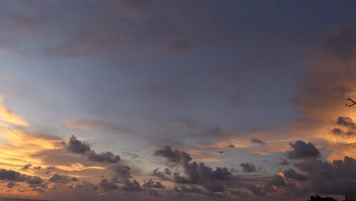kelan beach bali de gün batımı içeren Ücretsiz stok fotoğraf
