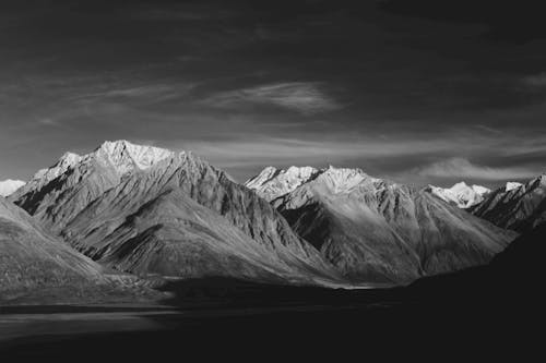 Black and White Photo of a Mountain Range 