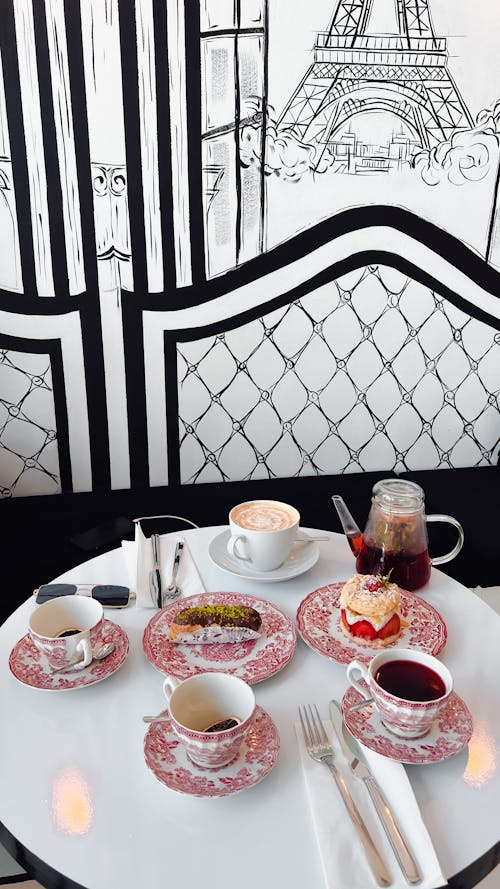 Porcelain Cups and Saucers on White Table