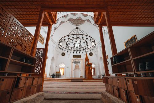 Free Explore the intricate architecture and serene atmosphere of a beautifully designed mosque interior. Stock Photo