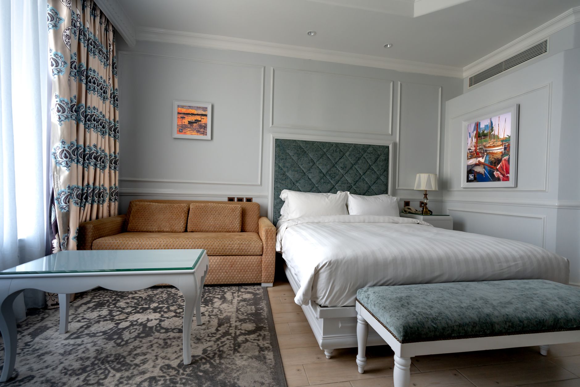 Boutique hotel courtyard with lanterns and a small bar in Lekki