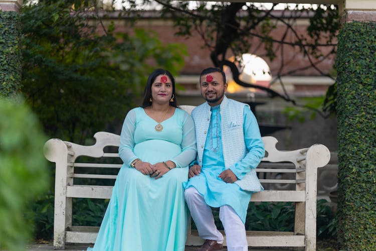 Couple Wearing Traditional Clothing Symbols On Forehead