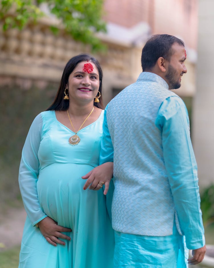 Couple Wearing Traditional Clothing Symbols On Forehead