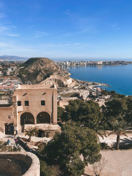 Discover the stunning coastal landscape of Alicante, Spain, with its historical architecture and azure sea.