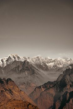 A breathtaking view of majestic snow-capped mountain peaks under a clear sky.