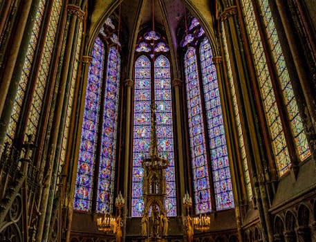 Intricate stained glass windows inside the iconic Amiens Cathedral in France.
