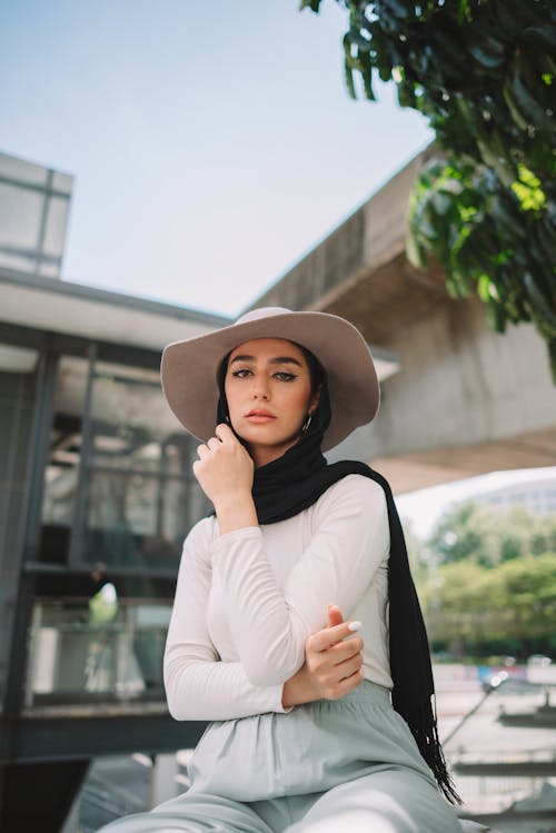 Beautiful Young Woman in a Hijab and Hat 