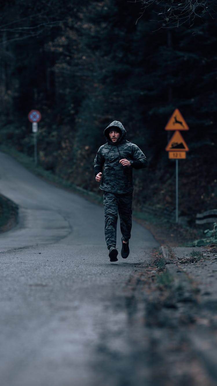 A Man Running On The Road