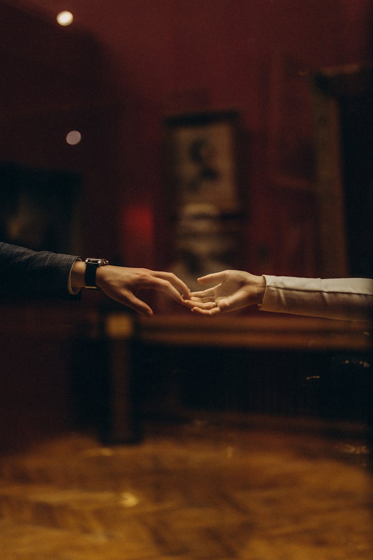 Photo Of Hands Touching Gently Fingers