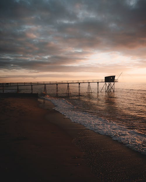 Photo of a Seascape with a Pier and a Fishing Cabin