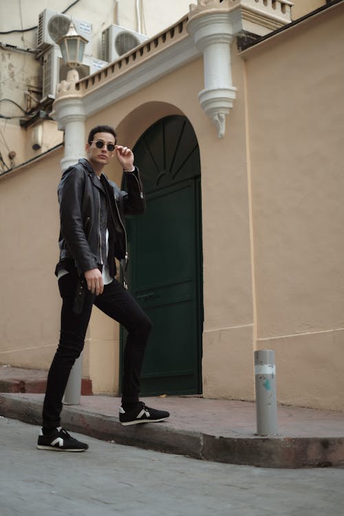 Man in Black Leather Jacket Posing on the Street