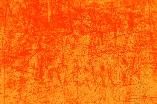 A vivid orange textured background with grunge effects, ideal for artistic design.