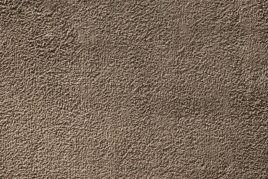 Close-up of a textured brown surface showcasing rough, intricate details.