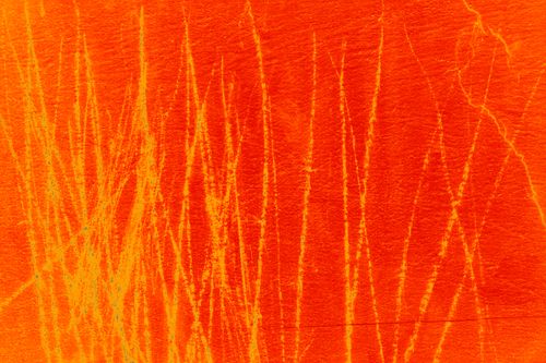 Free Dynamic abstract pattern in orange and yellow with a textured, scratched surface. Stock Photo