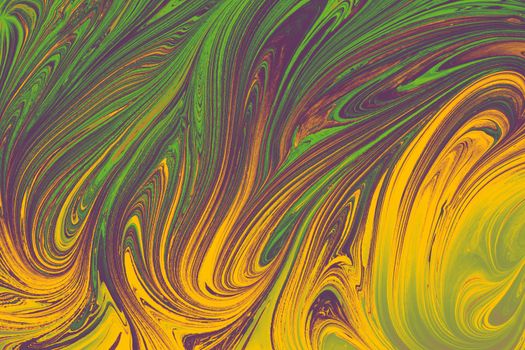 Dynamic abstract image featuring colorful swirling patterns in green, purple, and yellow hues.