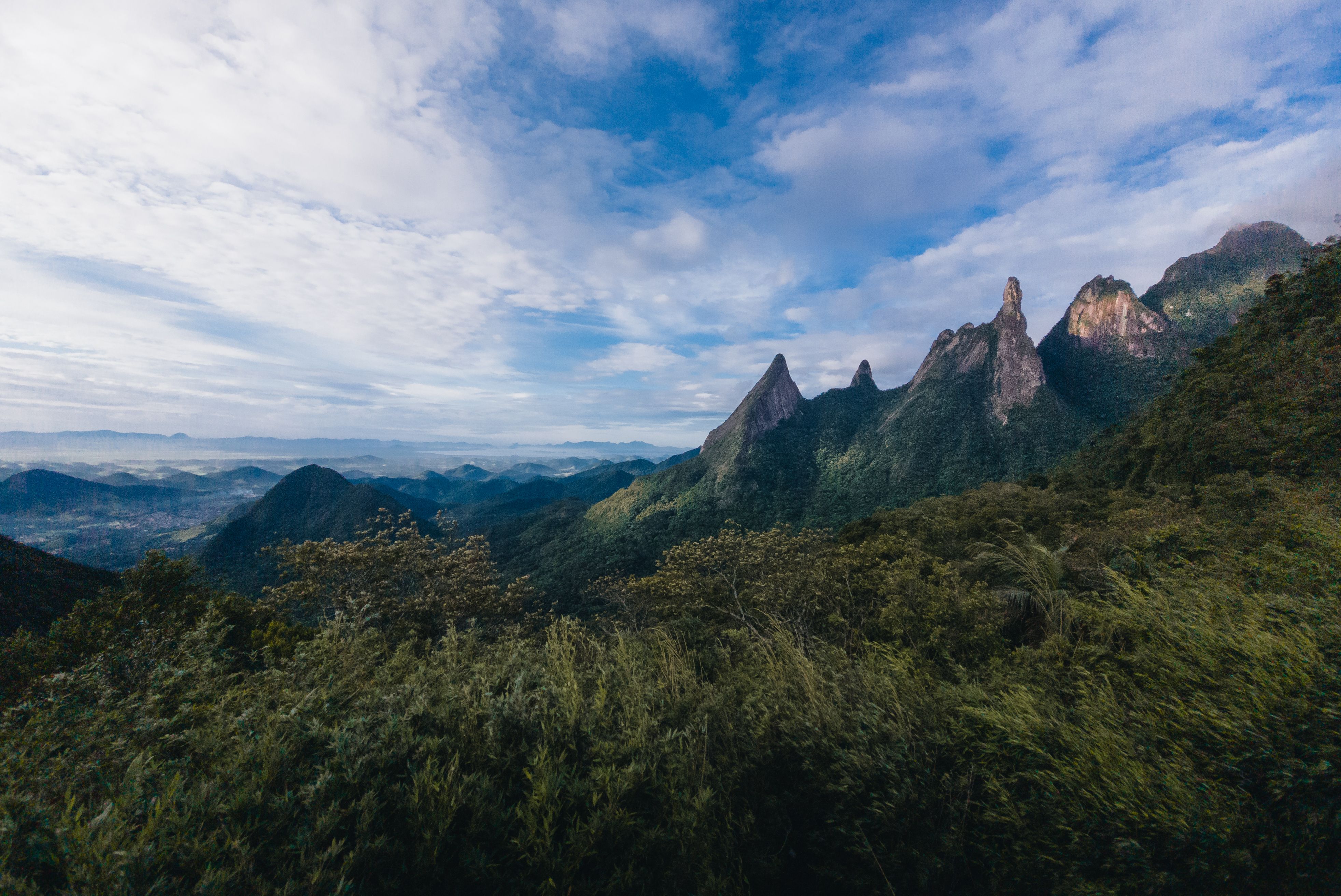 Breathtaking landscape of Organs Range mountains under a bright blue sky in Brazil.