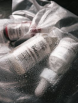 Skincare products by The Ordinary, encapsulated in a moisture-rich setup, highlighting hydration.