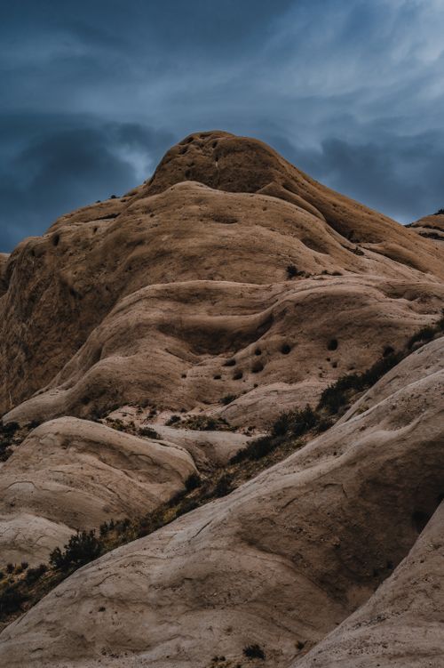 Free Striking rocky formations under a moody overcast sky, capturing natural beauty and texture. Stock Photo