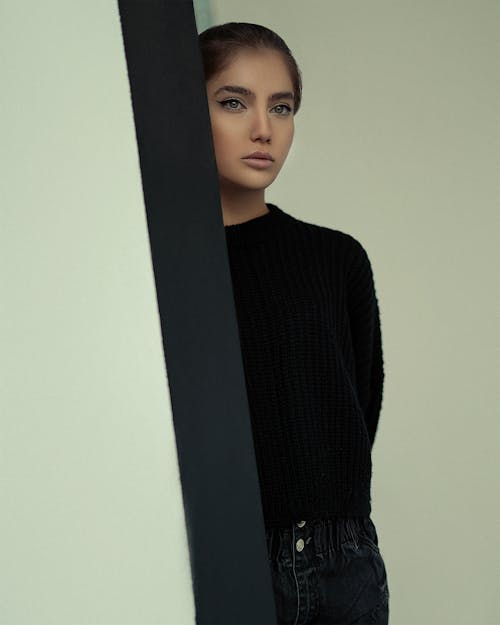 A Woman in Black Sweater Looking with a Serious Face