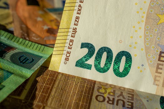 Detailed close-up of a 200 Euro banknote highlighting currency design and details.