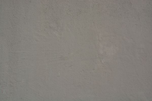 Grey concrete wall surface by Turgay Koca on Pexels