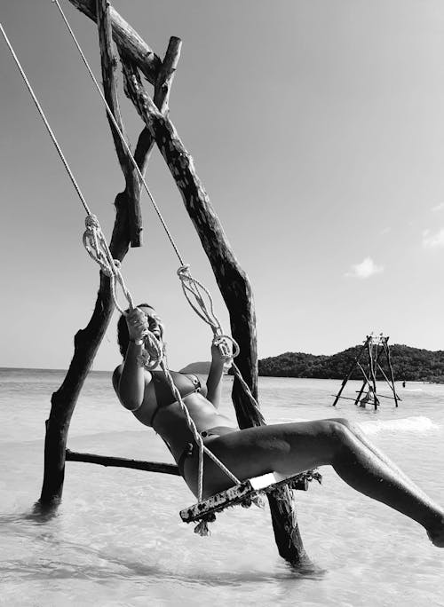 A Woman on a Swing at the Beach