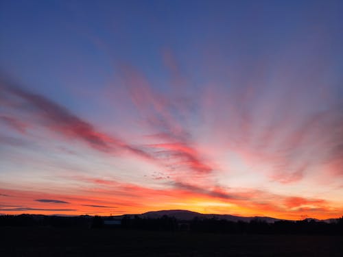 Gratis lagerfoto af dramatisk himmel, silhouet, skyer