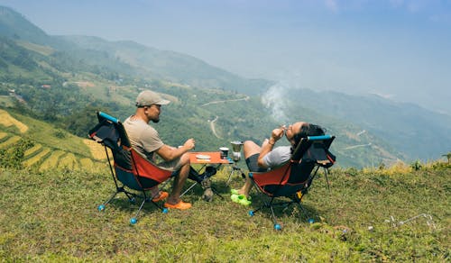 Men Sitting on Top of the Mountain