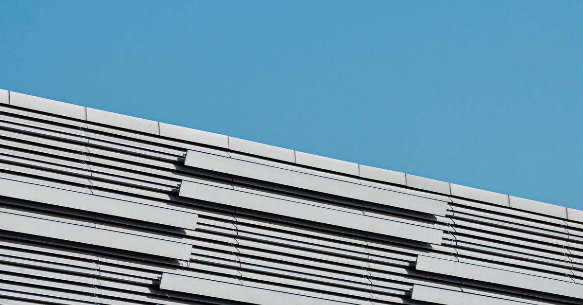 Sunlit, Gray Building Wall · Free Stock Photo