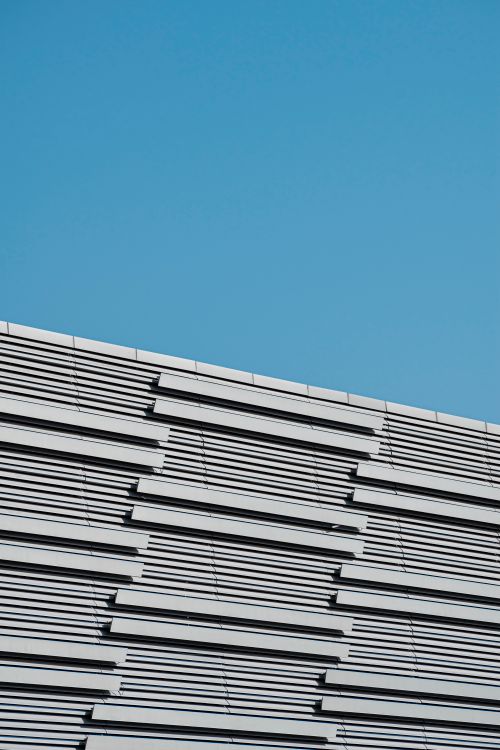 Sunlit, Gray Building Wall · Free Stock Photo
