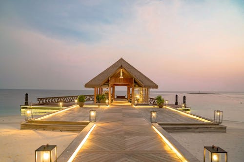 House on Illuminated Pier at Sunset