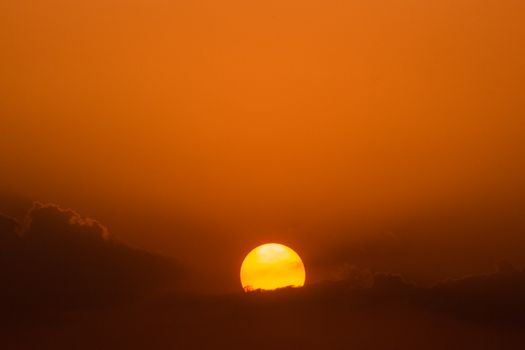 Stunning sunset with golden hues over Michoacán, Mexico, capturing serene nature's beauty.