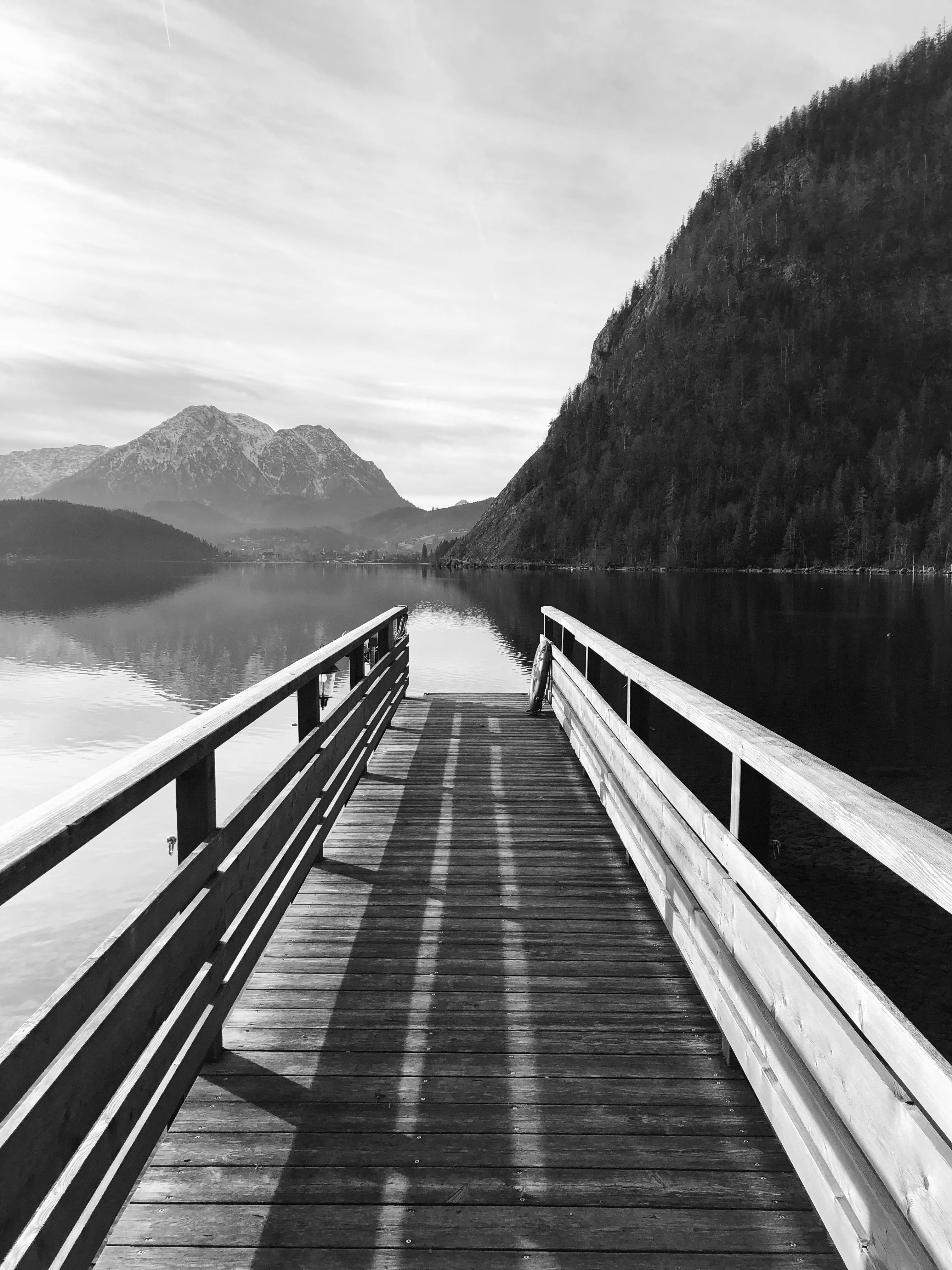Black and White Photo of a Mountain Lake with a Wooden Platform · Free ...