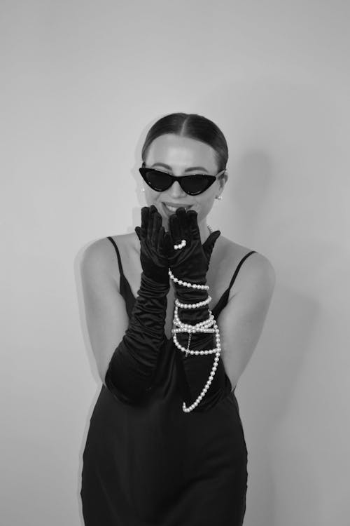 Monochrome Photo of a Woman wearing Opera Gloves