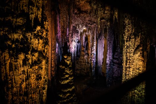 Photo from a Cave with Illuminated Stalactites