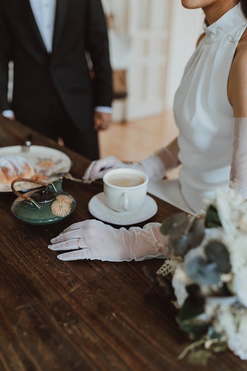 Close up of Bride Standing by Table