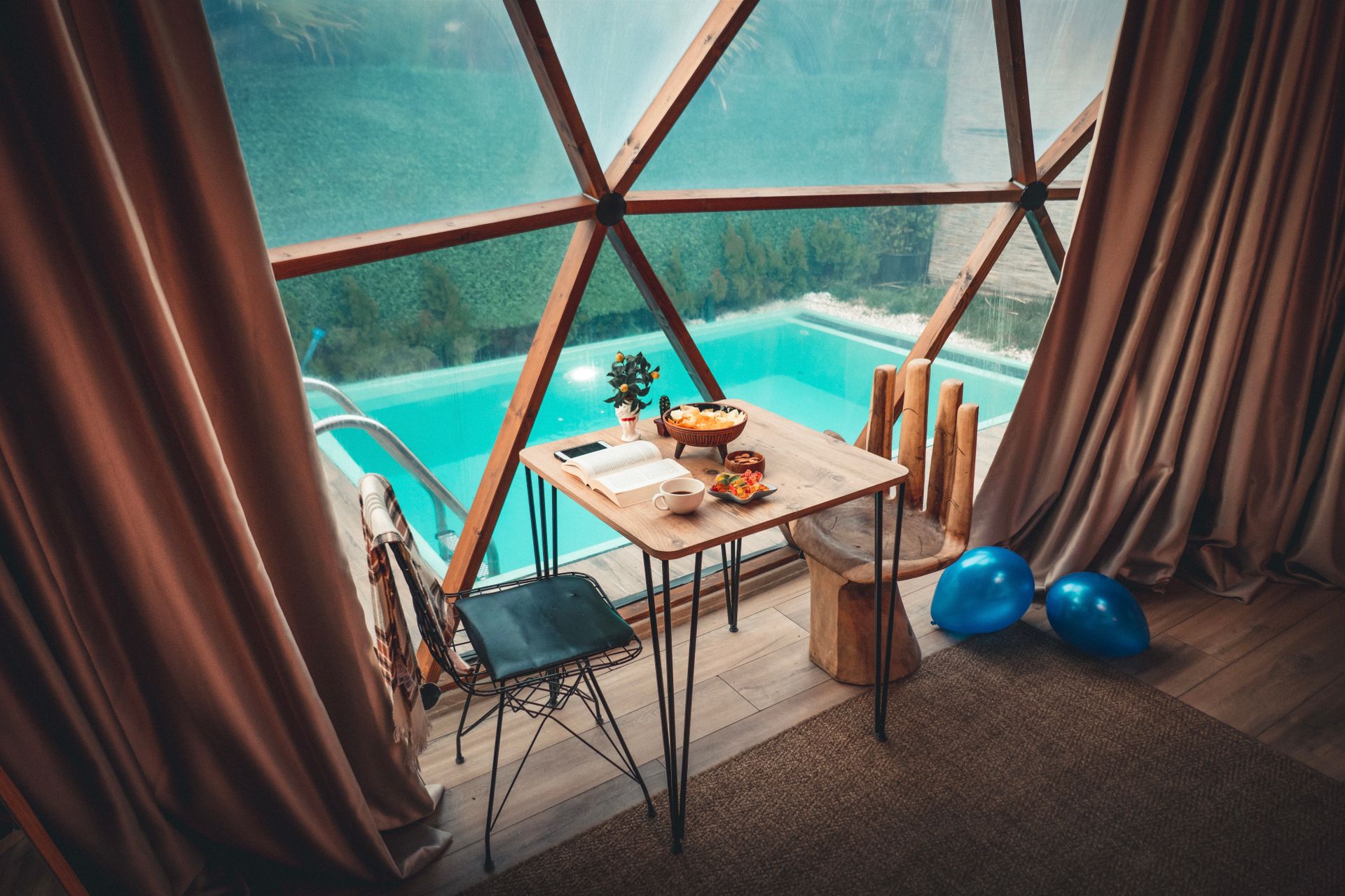 Photo of a Seating Place with the View on a Swimming Pool